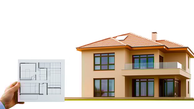 Hand holding architectural plans in front of a modern house with large windows and balcony photo