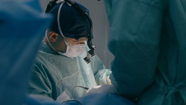 Doctor man in uniform physician surgeon medic nurse performing surgical operation at hospital clinic plastic surgery microsurgery saving life patient health emergency medical help medicine healthcare photo