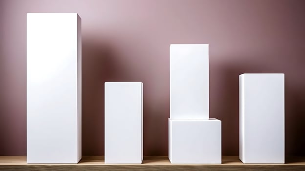 Minimalist display of white geometric shapes on a wooden shelf against a pink background photo