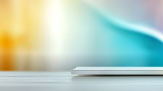 Minimalist workspace with a sleek laptop on a wooden table, vibrant blurred background photo