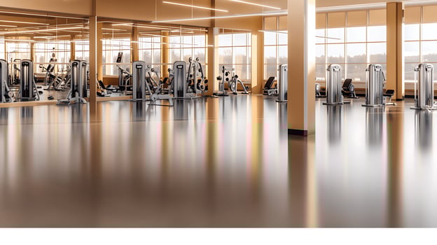Modern gym interior showcasing fitness equipment with natural light and spacious layout photo