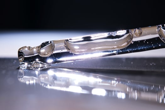 A serum pipette on a dark background. photo