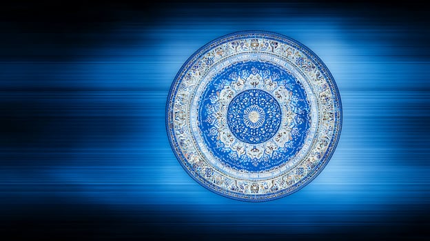 Ornate blue and white decorative plate centered against a blurred blue background photo