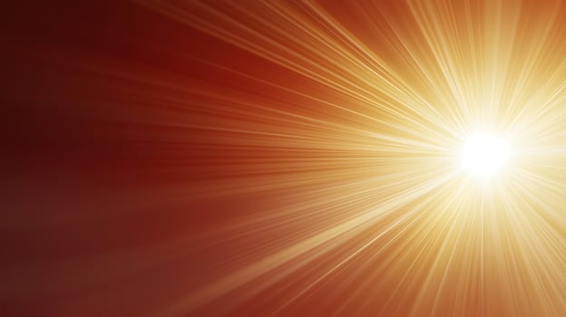Radiant sunburst effect with vibrant orange and yellow rays illuminating a warm background photo