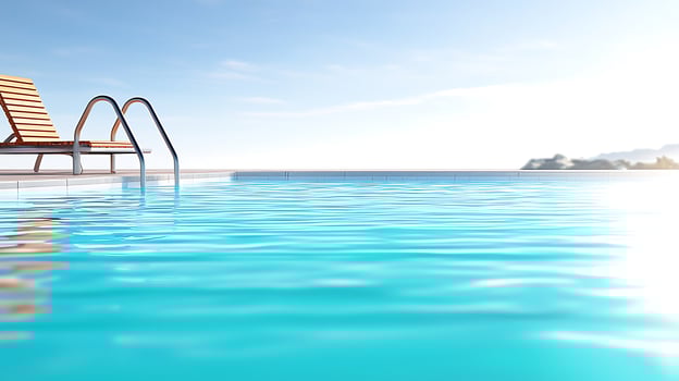 Serene poolside view with lounge chair, sparkling water, and distant mountains under clear sky photo
