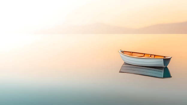 Serene sunset over calm waters with a solitary boat reflecting on the surface photo
