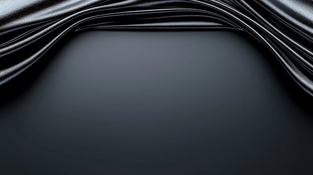 Smooth, glossy black fabric draped elegantly, creating a luxurious backdrop for creative projects photo