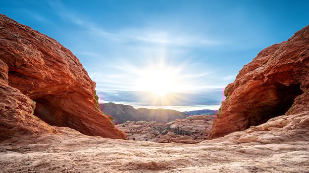 Stunning sunset view between red rock formations, showcasing nature's beauty and serenity photo
