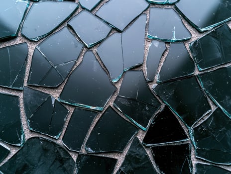 A mosaic of broken glass shards photo
