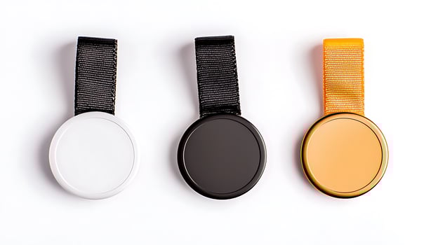 Three blank medals in different colors displayed on a white background for award design purposes photo