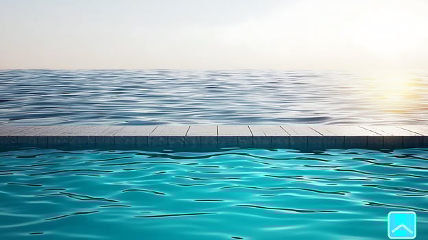 Tranquil poolside view at sunset, with calm waters reflecting the warm sky and horizon photo