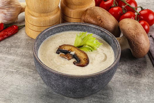 A bowl of soup with mushrooms and vegetables photo
