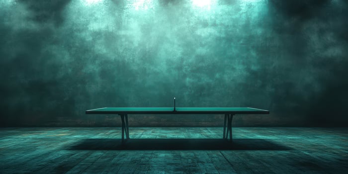 Table tennis setup in a dimly lit, atmospheric room with blue-green hues and dramatic lighting photo