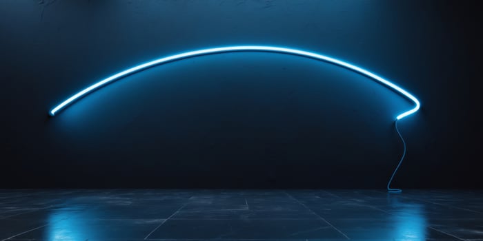 A neon blue curved wall with a light bulb photo