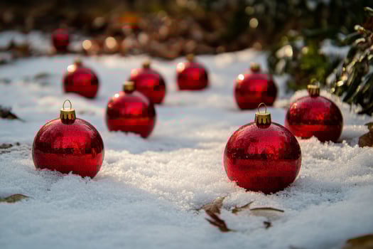 A group of red christmas balls in the snow photo