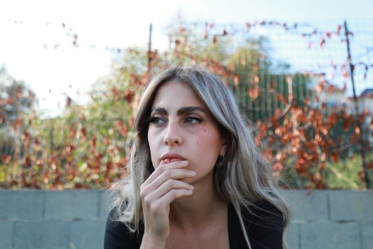 Woman Seeks Clarity While Sitting Alone in Park photo