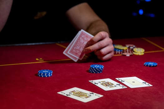 A man is playing poker with cards and chips photo