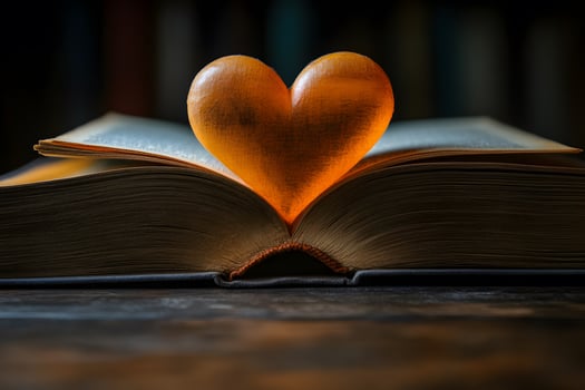 Heart-Shaped Light Illuminating Open Book - Symbol of Love and Knowledge for Educational Design photo