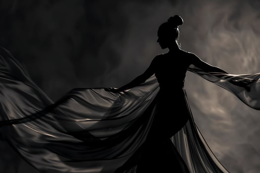 A woman in a long dress is dancing in the dark photo