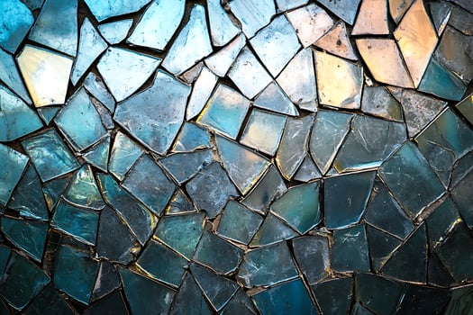 A blue and gold mosaic wall with many different colors photo