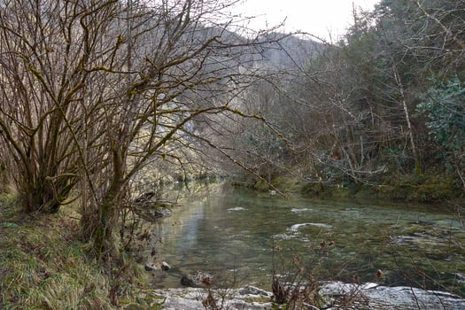 Peaceful nature trail along Rio Dobra towards the stunning Olla de San Vicente in Asturias photo