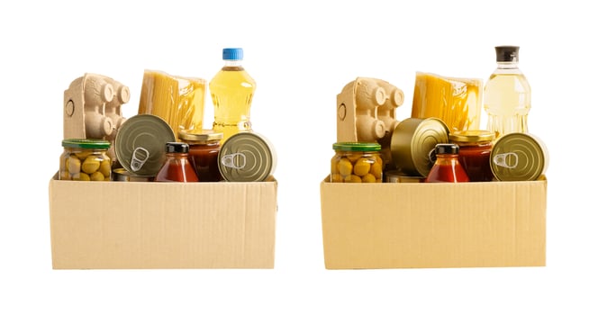 Foodstuffs in donation box isolated on white background for volunteer photo
