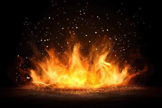Fiery orange flames against a black backdrop, with golden sparks adding a touch of magic and warmth photo