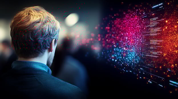 A person observing a vibrant digital display filled with data visualization in a crowded space photo