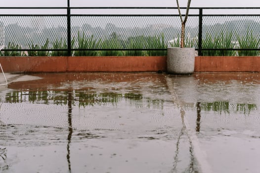 Rainy day reflections on a modern balcony with minimalist design elements photo