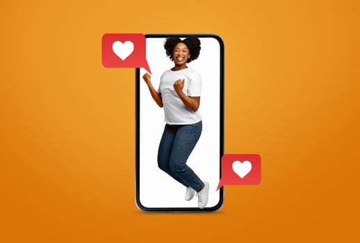 A person expresses excitement while holding a smartphone, surrounded by symbols of love. This playful collage highlights the joy of connecting over social media and messaging apps. photo