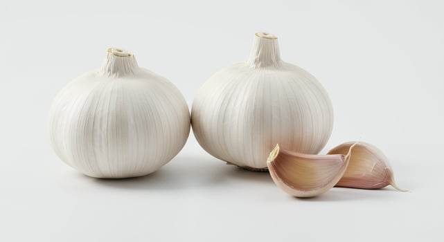 Two Whole Bulbs and Separated Cloves of Fresh Garlic on White Background photo