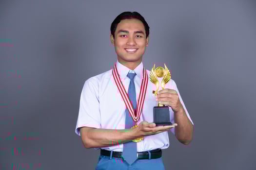 Indonesian Male High School in Uniform Student Achieves Gold Medal Background photo