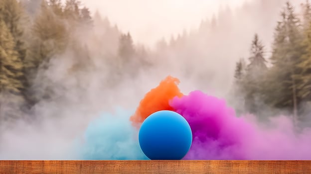 Vibrant blue sphere surrounded by colorful smoke in a misty forest setting at dawn photo
