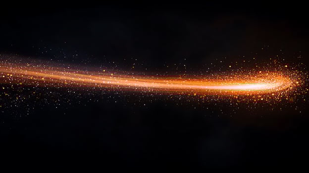 Vibrant orange comet trail with sparkling particles against a dark background, evoking cosmic motion photo