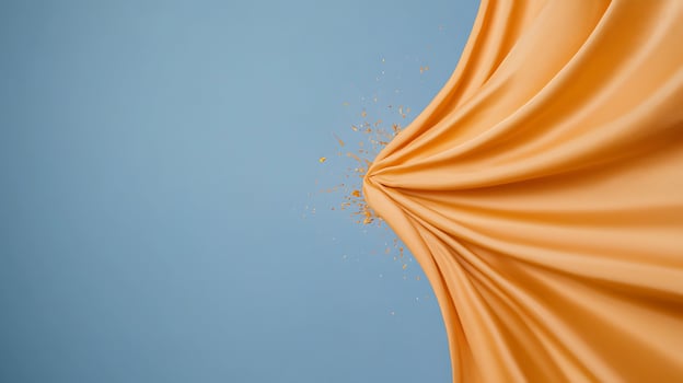 Vibrant orange fabric stretching against a blue background, creating dynamic movement and energy photo