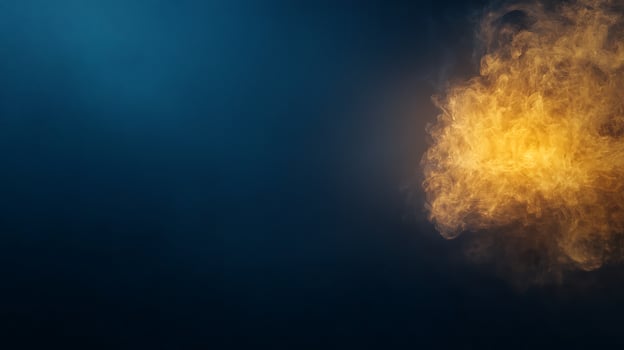 Vibrant orange smoke cloud against a dark blue background, creating a dramatic atmosphere photo
