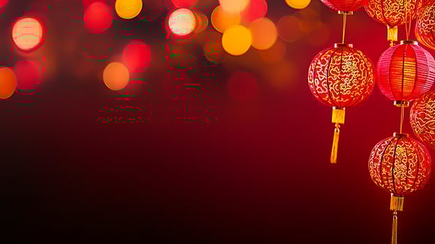Vibrant red lanterns hang against a blurred festive background of glowing lights photo