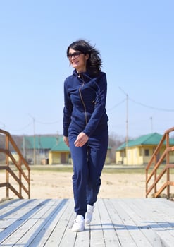 Cheerful Russian woman running towards the camera and laughing photo