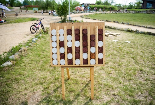 Wooden game Connect Four known as Connect 4, Four Up, Plot Four, giant figures without people photo