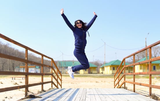 Cheerful 45 y.o. Russian woman jumping and laughing photo
