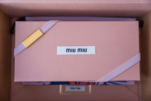 Prague, Czech republic - January 9, 2025. Miu Miu luxury sunglasses packaging in soft pink color photo