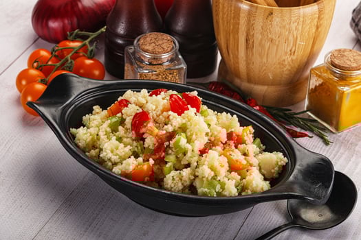 A bowl of food sitting on a table photo