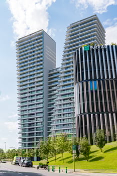 Prague, Czech republic - July 28, 2024. Modern V Tower skyscrapers in Pankrac with greenery photo