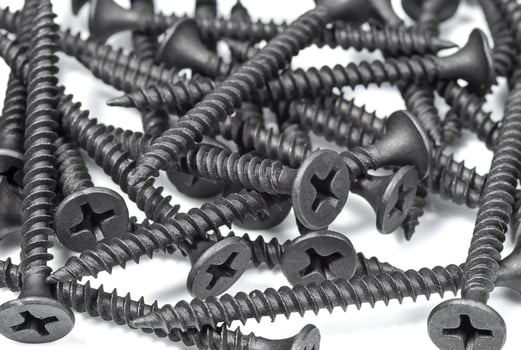 Black screws on a white background photo