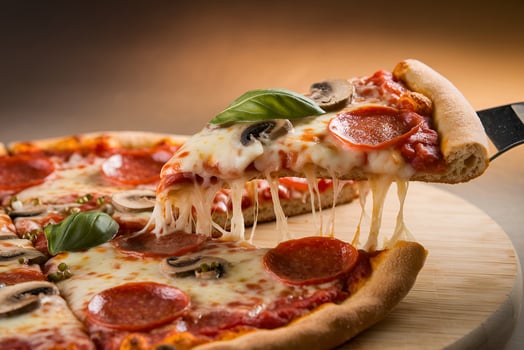 Delicious Pizza Slice with Melted Cheese Pulled Out photo