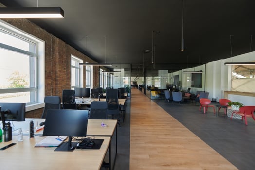 In a setting of modern, glass-walled business startup offices, the open, airy workspace reflects a contemporary and innovative ambiance, promising a dynamic environment for entrepreneurial growth photo