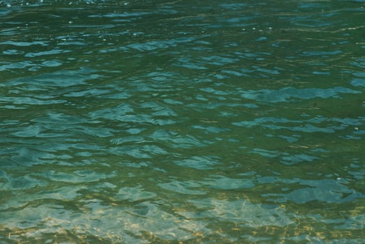 Blue water with ripples on the surface. photo
