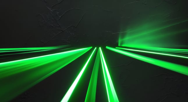 Green laser beams in a dark room photo