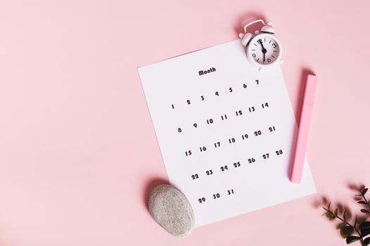Calendar, alarm clock and marker on pink background top view web banner photo