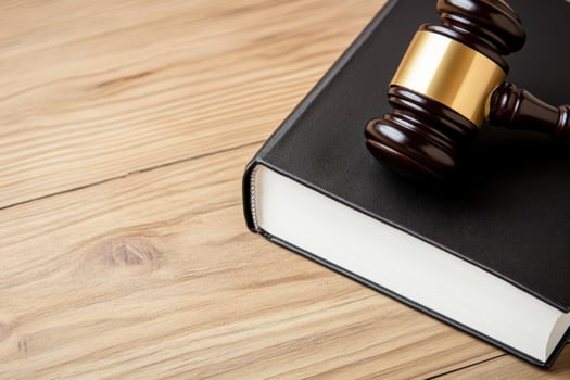 Gavel resting on a legal book symbolizing justice, law, and judiciary process in courtrooms photo